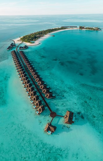 aerial view of maldives over water villas lined up