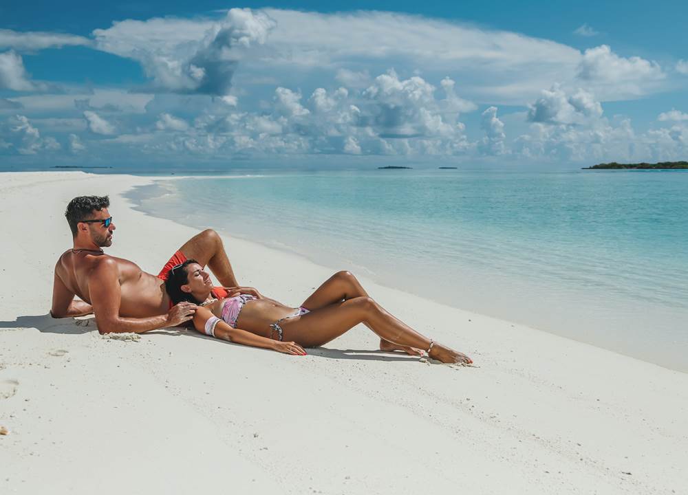 Couple sun bathing
