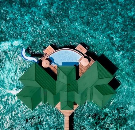 Aerial View Siyam World Maldives - Grand Water Pavilion with Pool + Slide