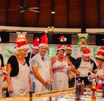 Guests participate in Fruit Cake Mixing at Sun Siyam Iru Fushi, Maldives for festive